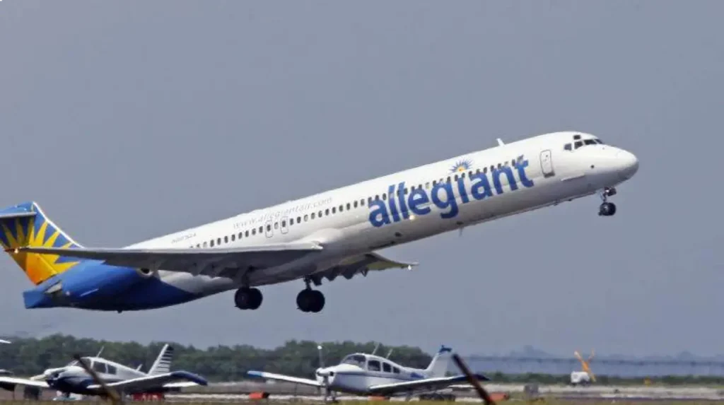 Allegiant Air aircraft taking off from LAX runway during departures.